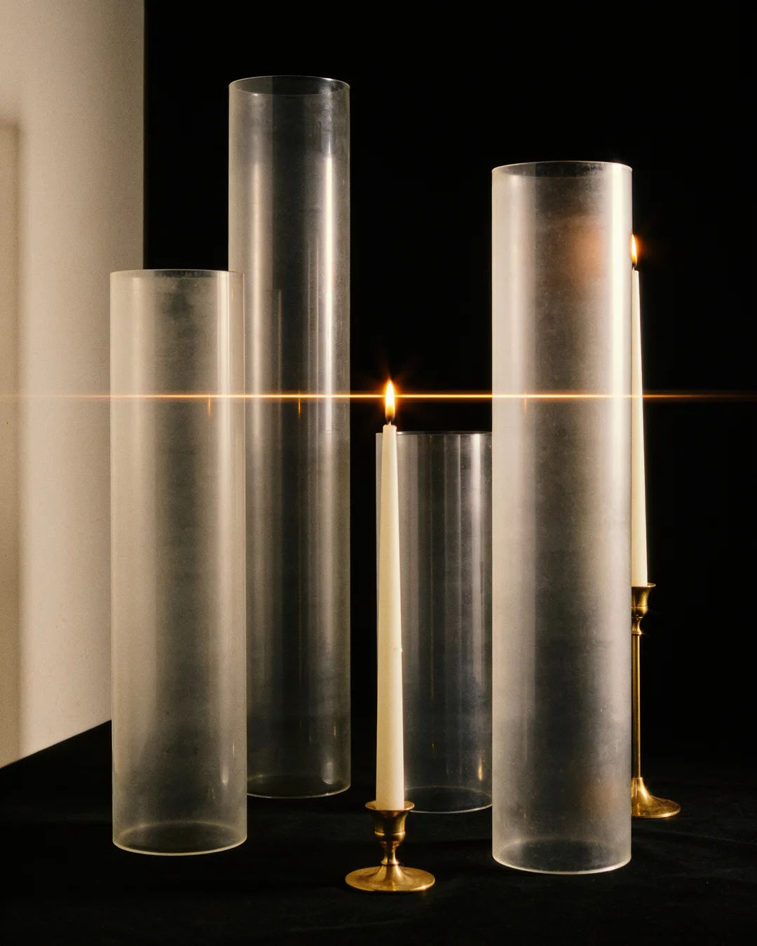 Glass columns of different heights with a glowing limit line