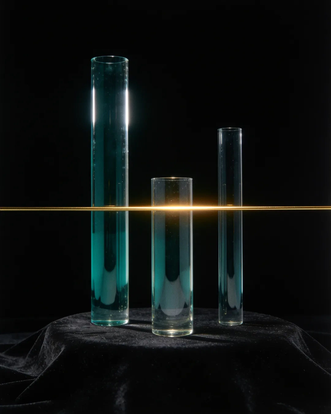 Glass columns of different heights with a glowing limit line