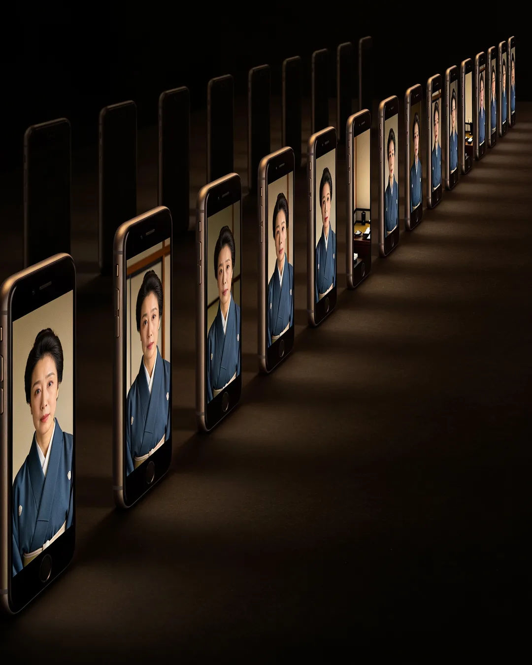 A row of phones showing episodes of the same Japanese drama series