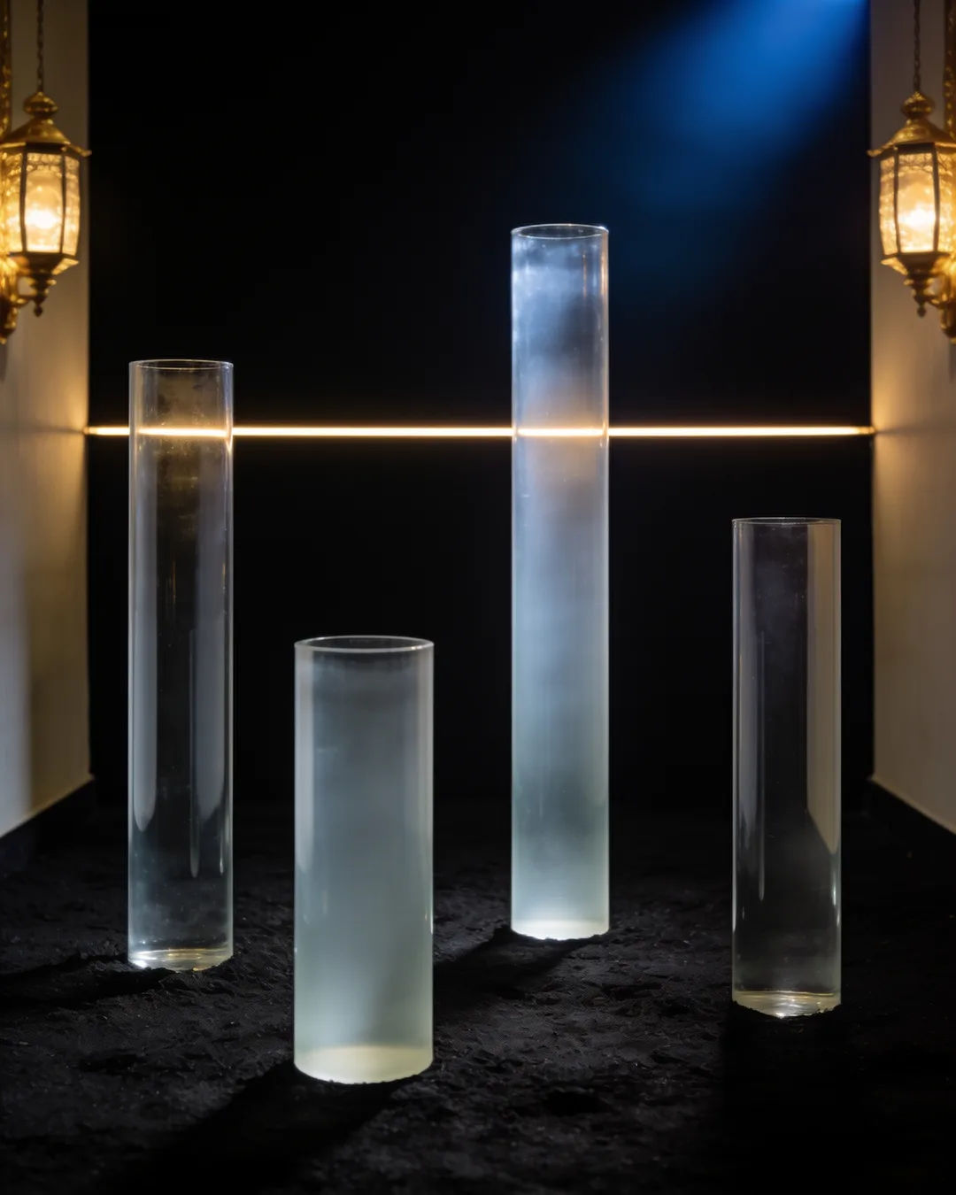 Glass columns of different heights with a glowing limit line