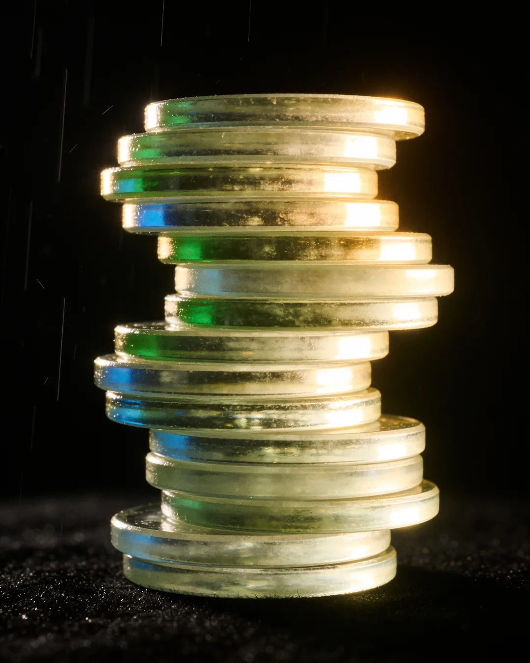 Stacks of glass tokens rising on a black ground