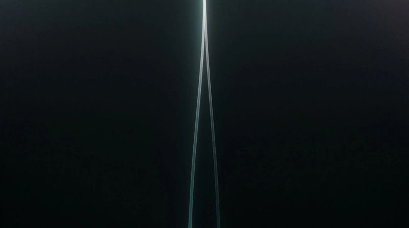 Two thin lines of cool white light converging to a point