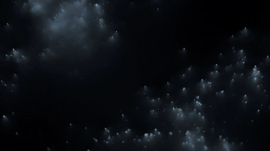 Many small points of light scattered through depth, joined by faint threads