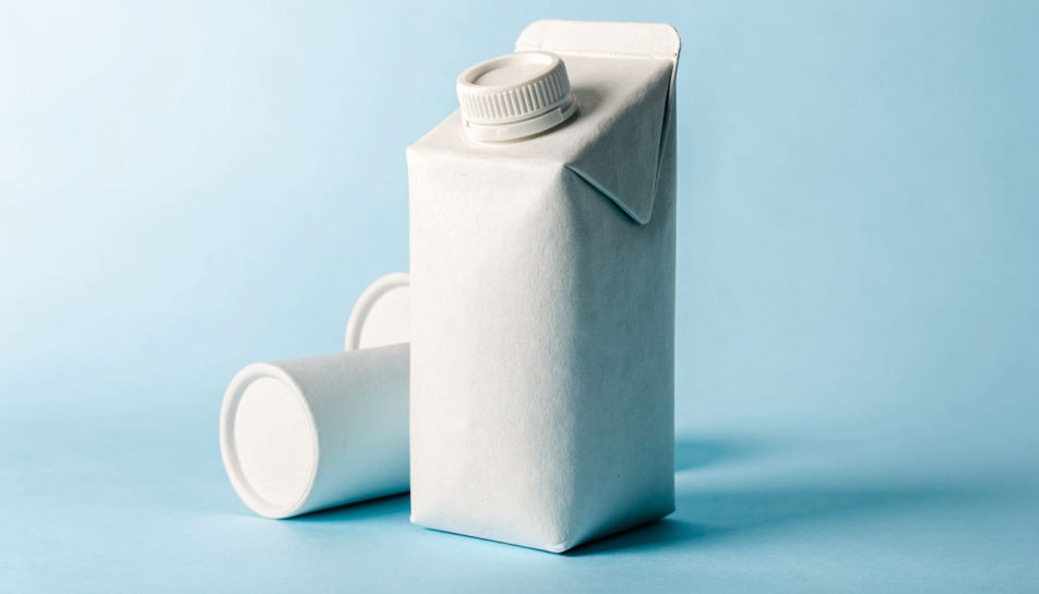 Plain white carton concept on a pale blue set in soft studio light
