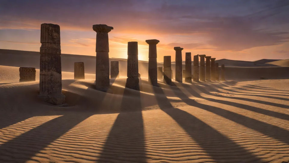 Sand-buried colonnade at dusk