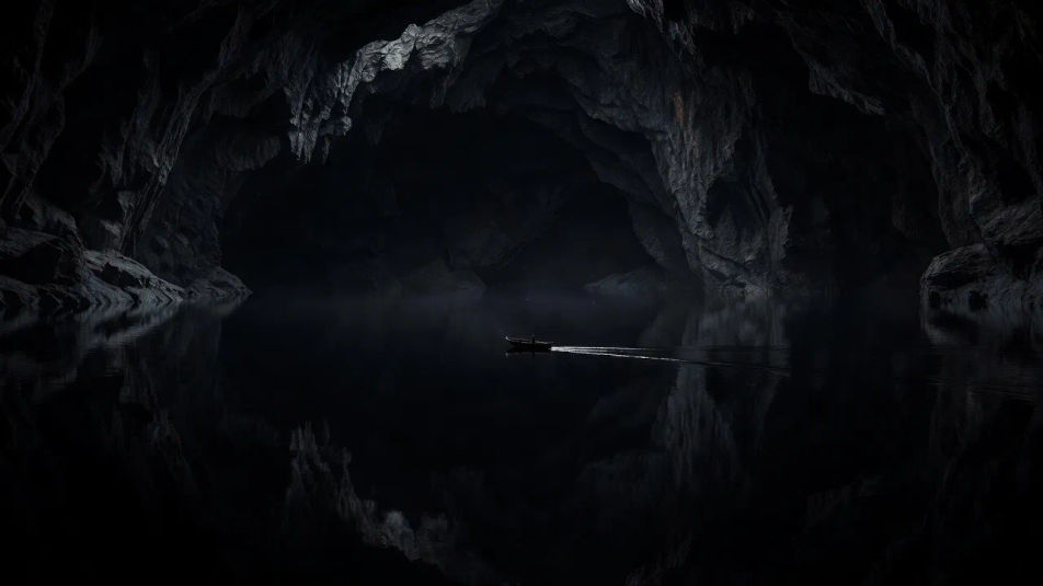 Boatman crossing the dark water