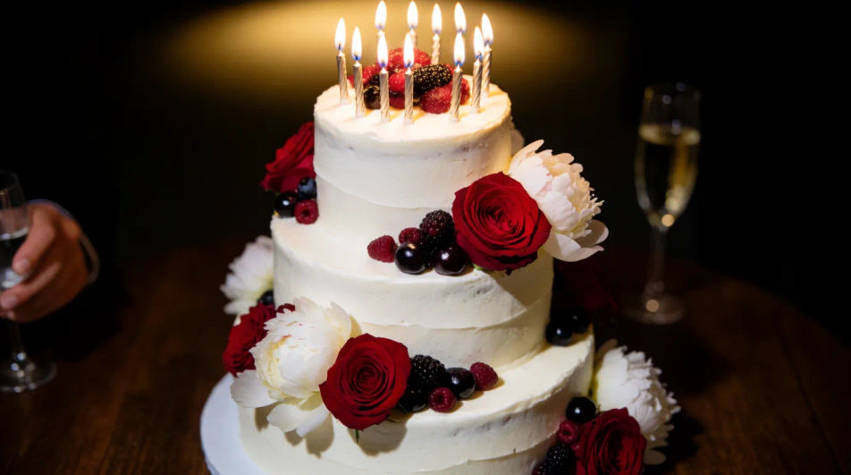 Multi-tiered cake with candles