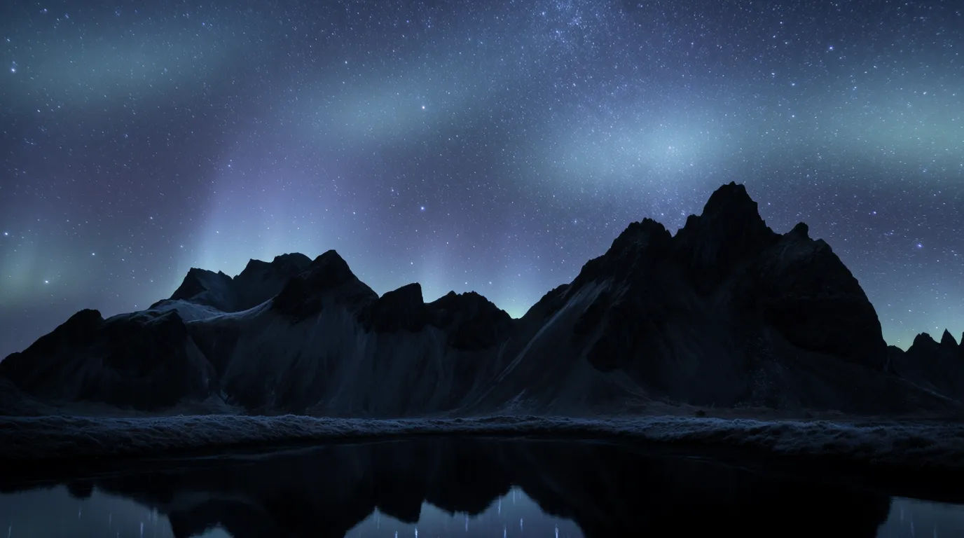Stars over mountain peak