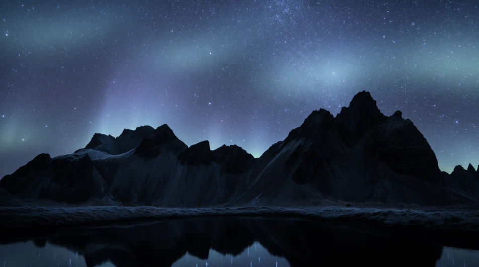 Stars over mountain peak