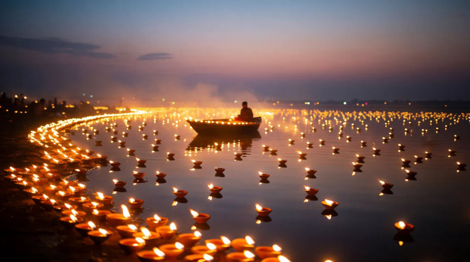 Diyas line the shore