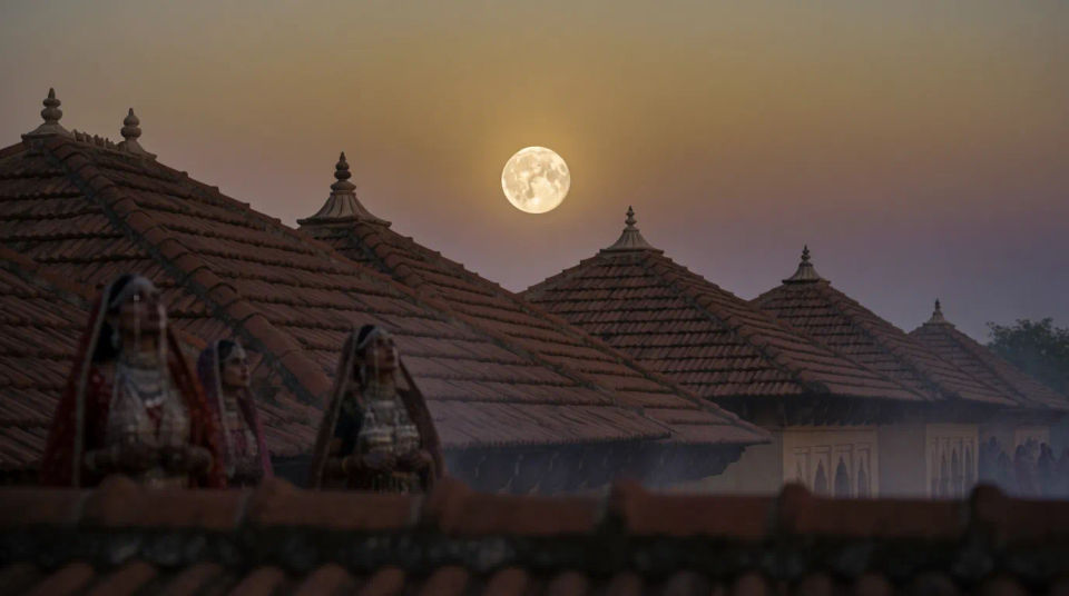 Full moon over rooftops
