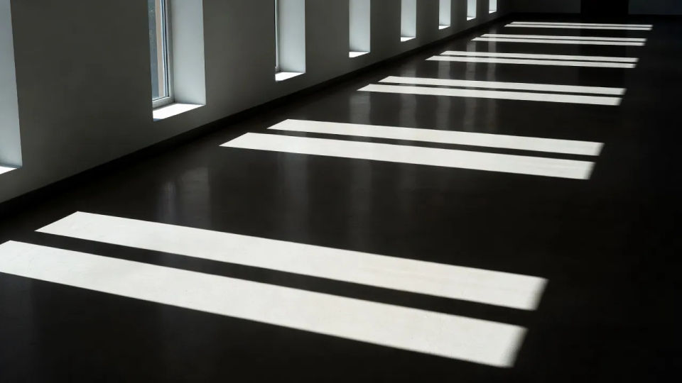 Corridor light-and-dark establishing shot
