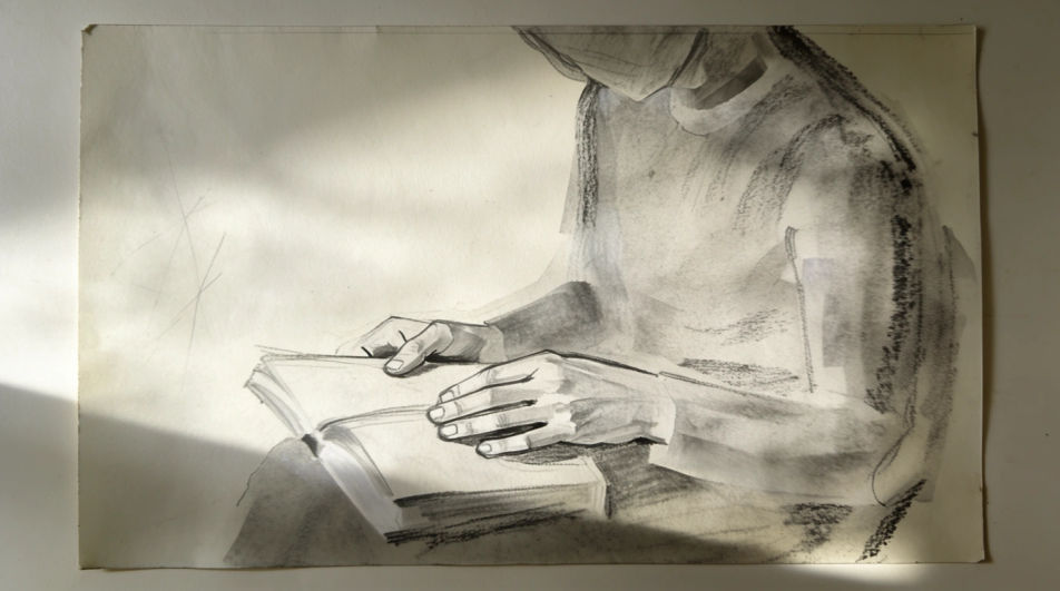 Seated figure reading
