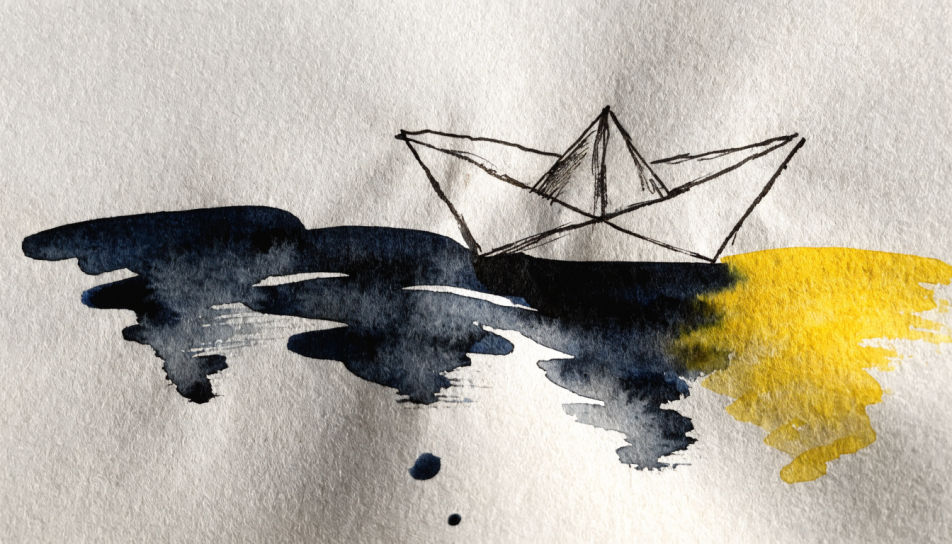 Paper boat on water