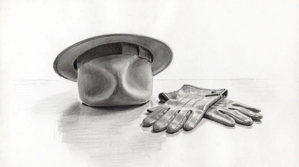 Hat on a table beside gloves