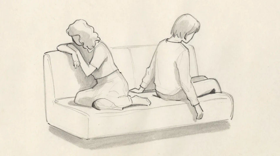 Two figures at either end of a sofa