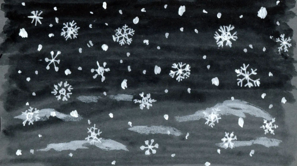 Snowflakes falling over a dark sky