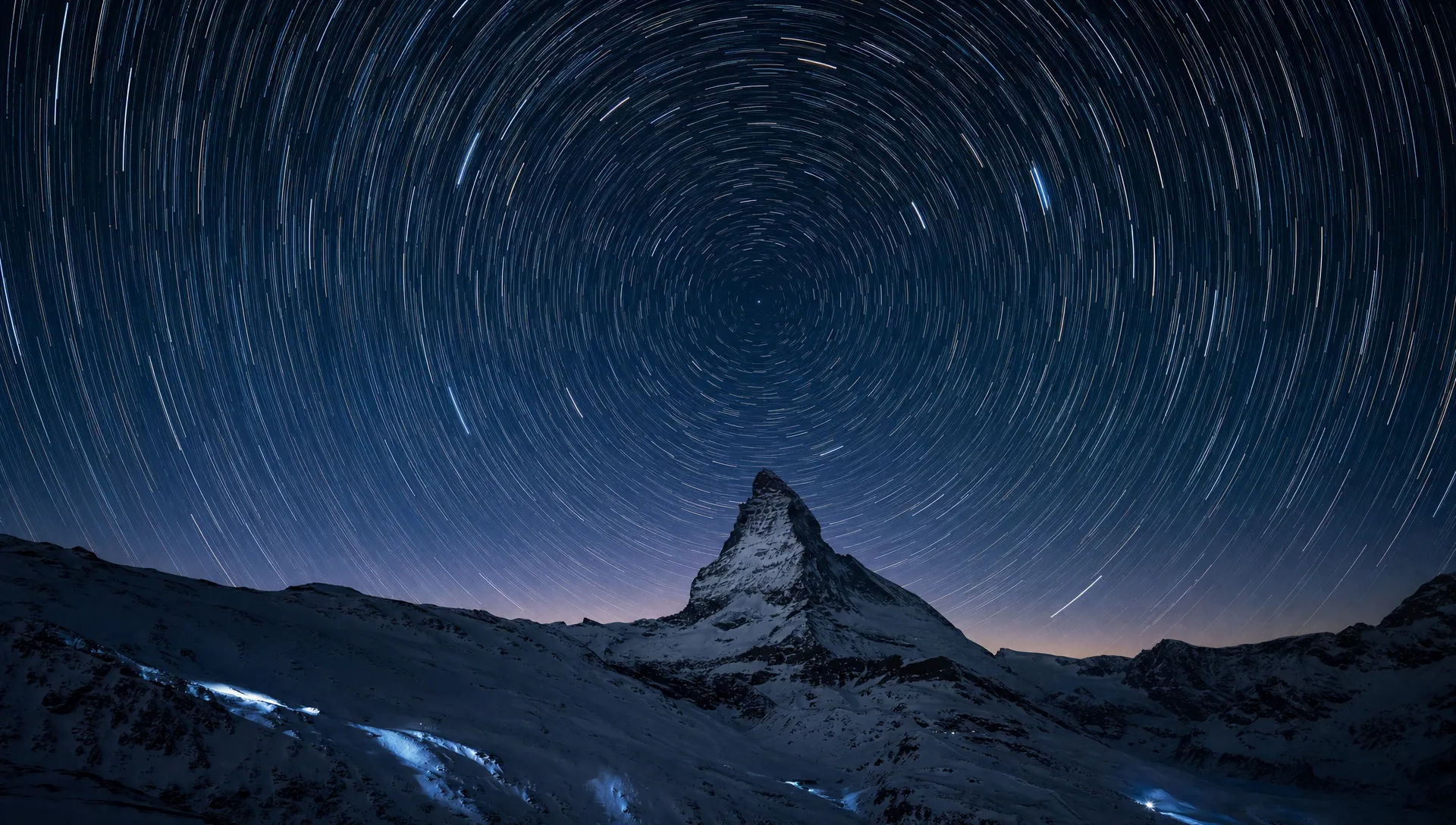 Star trails over a mountain peak