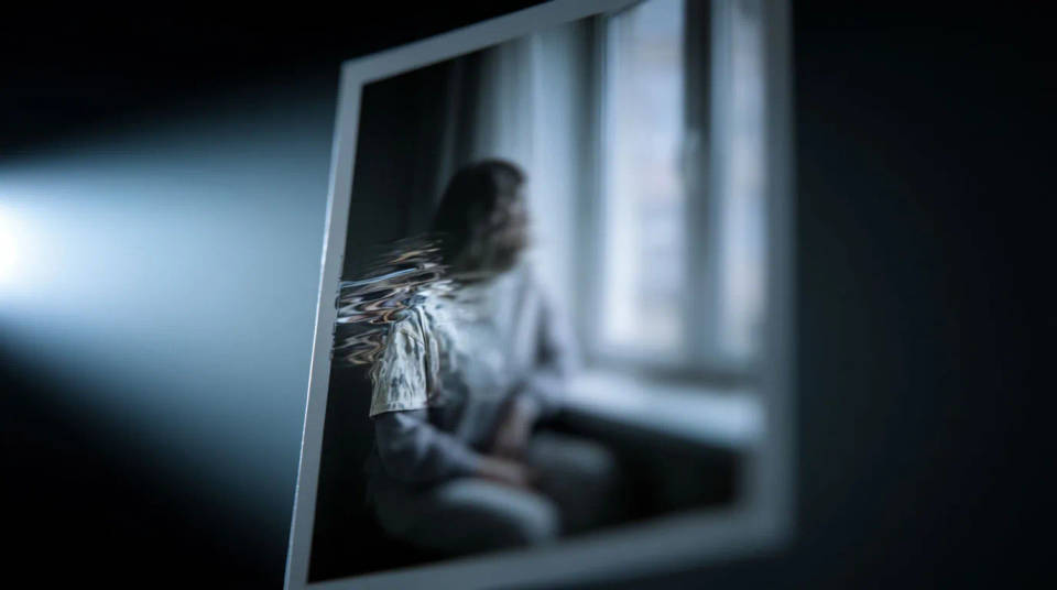 A generated video frame with a warped hand and a morphing detail called out