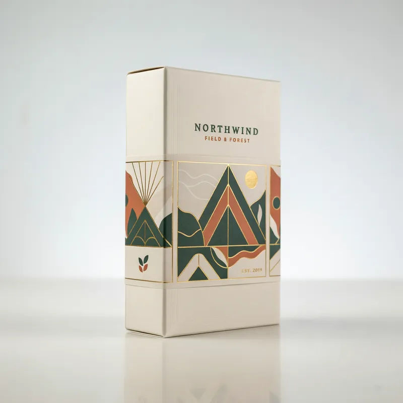 Uploaded label wrapped onto a hardcover packaging box on a studio table