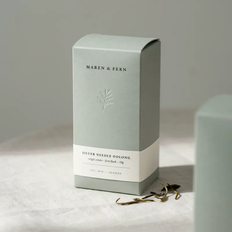 Sage green folding carton for artisan tea with clean serif type