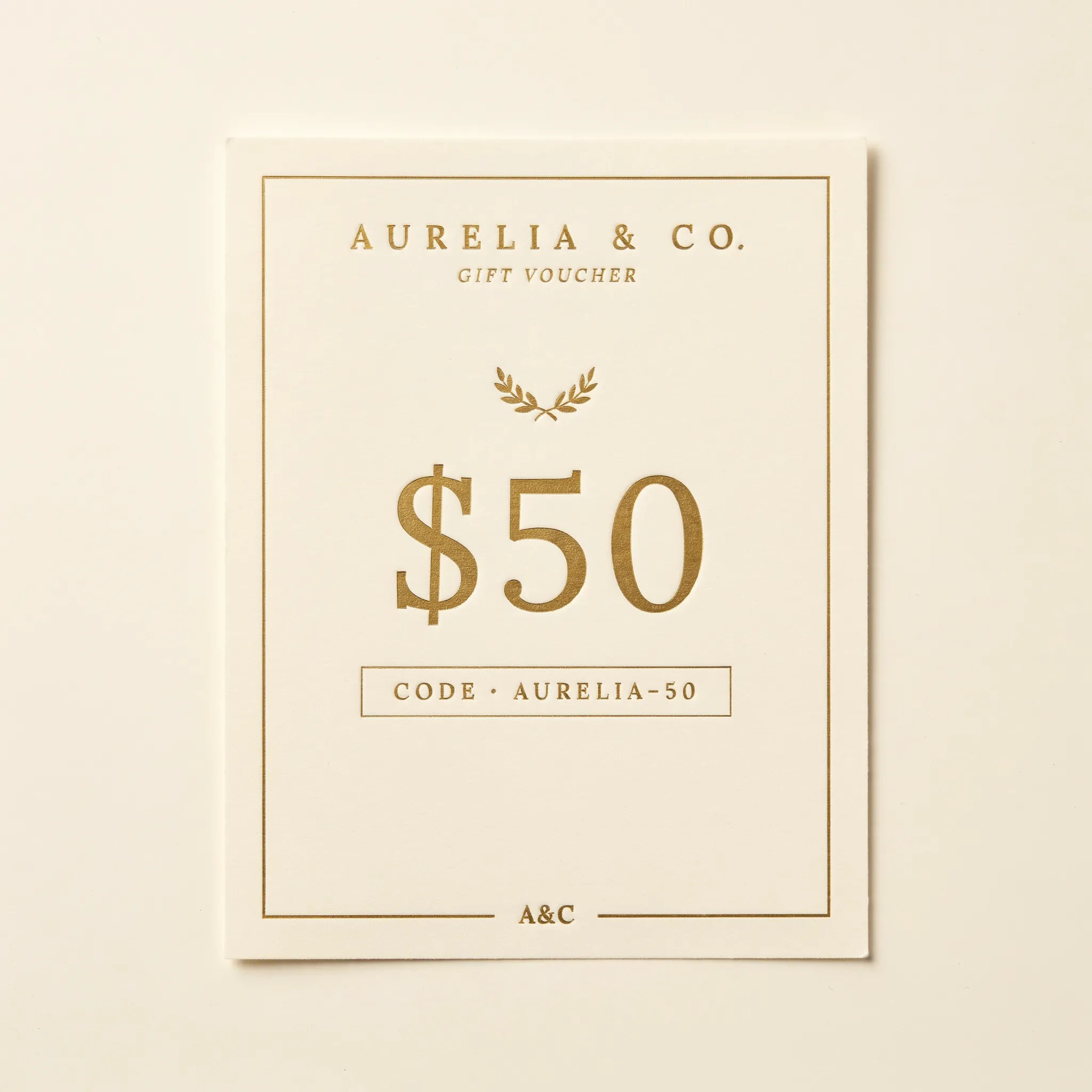 Minimal premium gift voucher in cream and gold with a code block