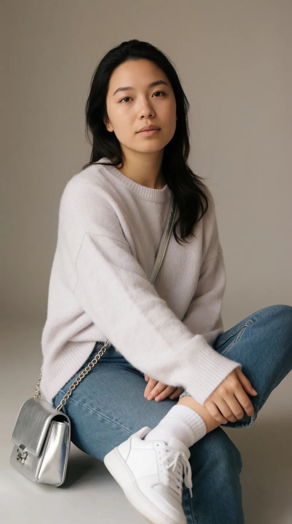 Virtual creator studio portrait in a casual outfit under soft daylight on a neutral backdrop