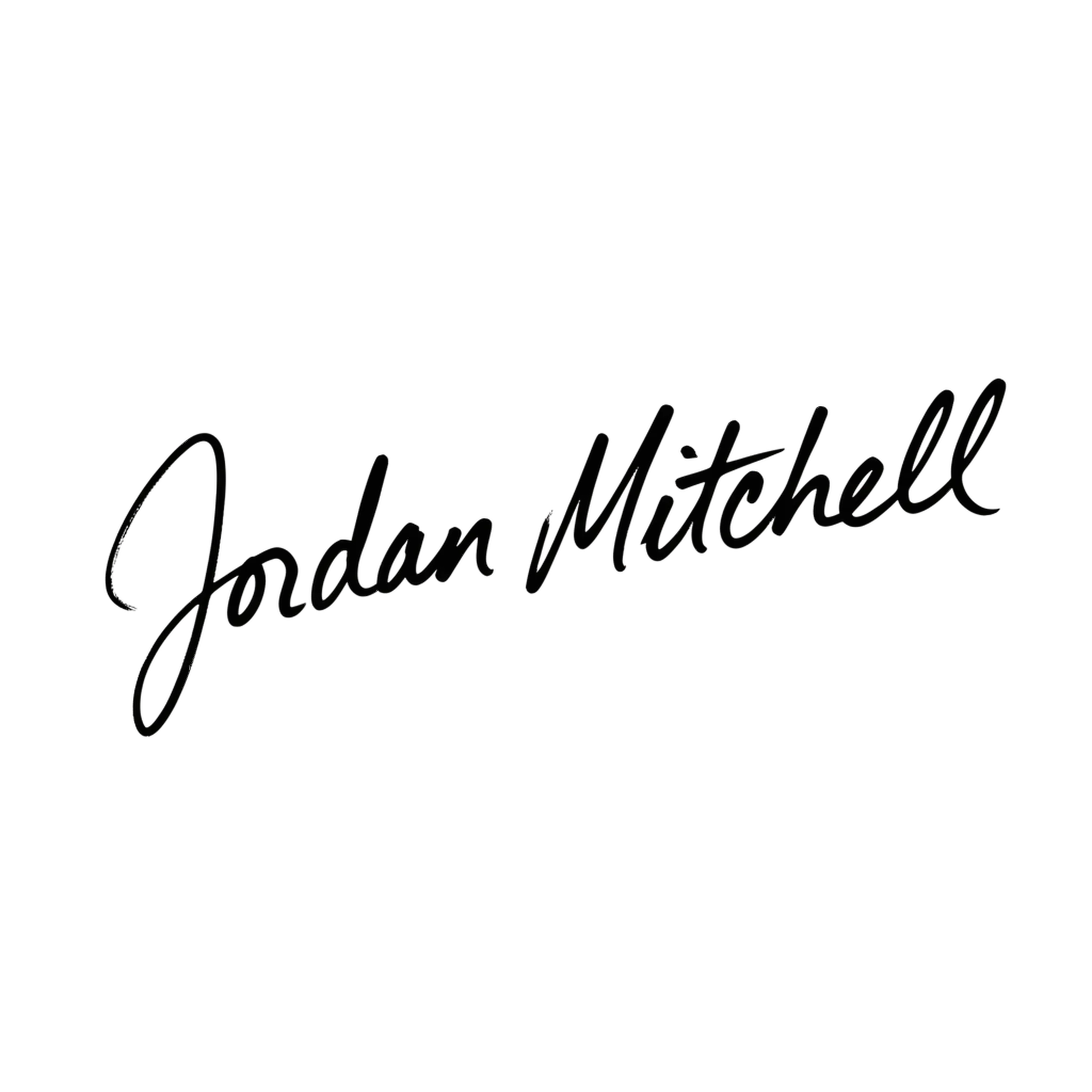 Bold black marker signature of a full name with a slight slant