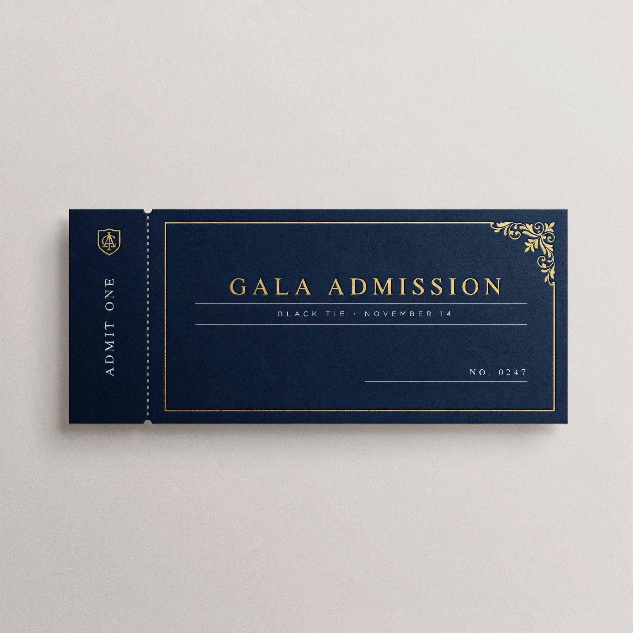 Elegant navy and gold gala admission ticket with a matching stub