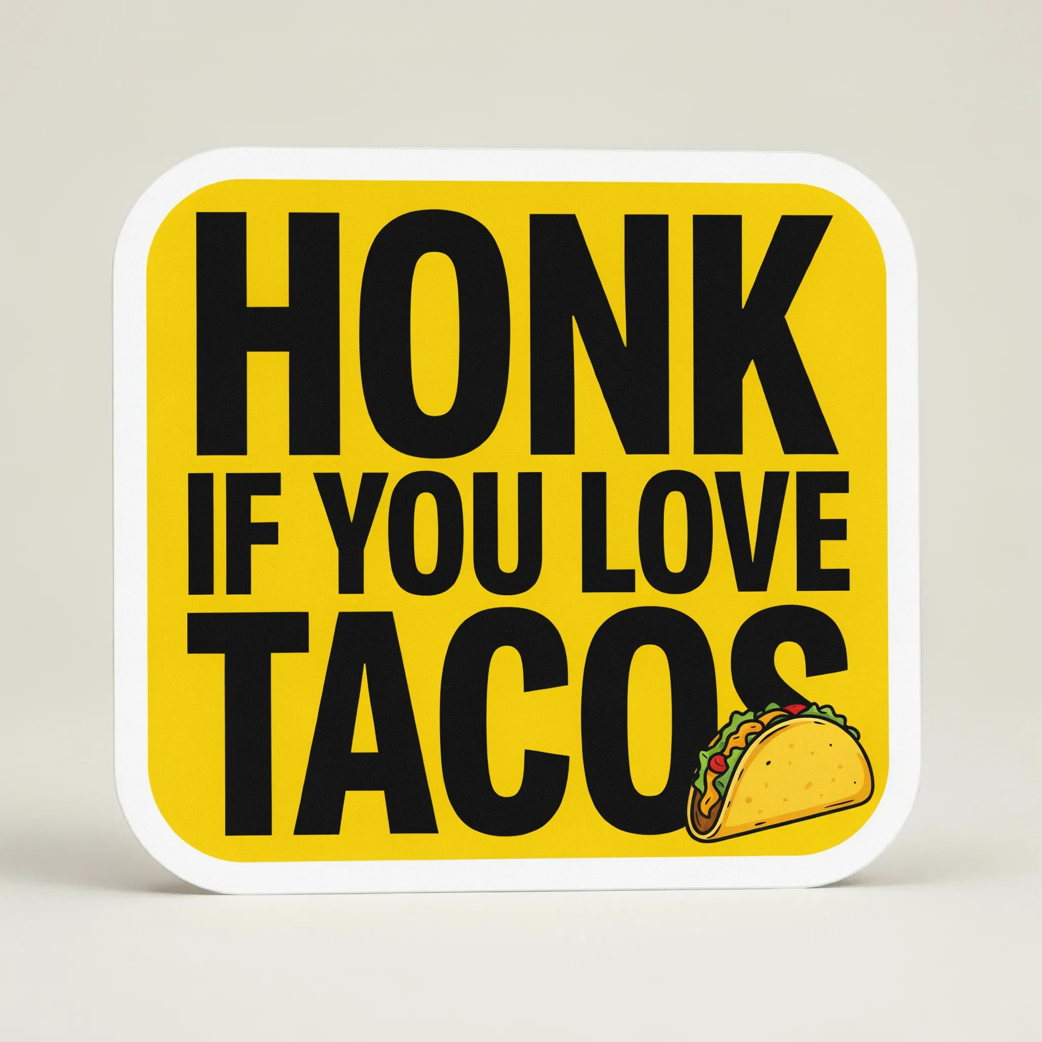 Bright yellow bumper sticker with a bold black joke line