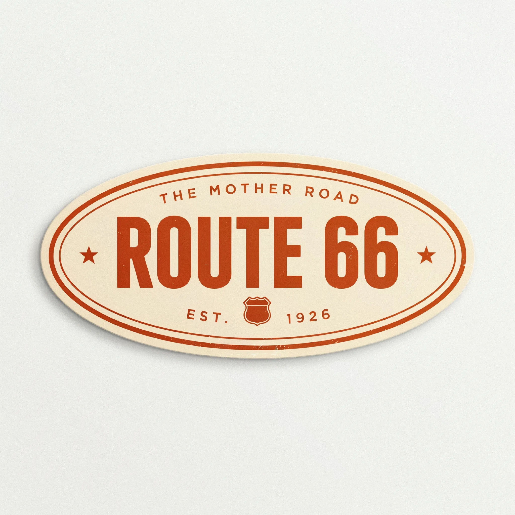 Retro cream and orange oval sticker with vintage Route 66 lettering