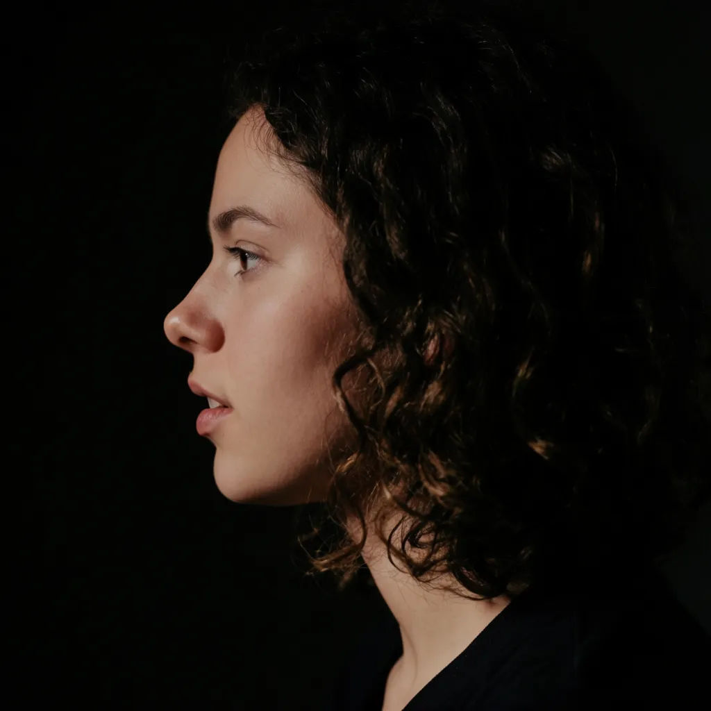 Portrait reframed from front-facing to a side profile