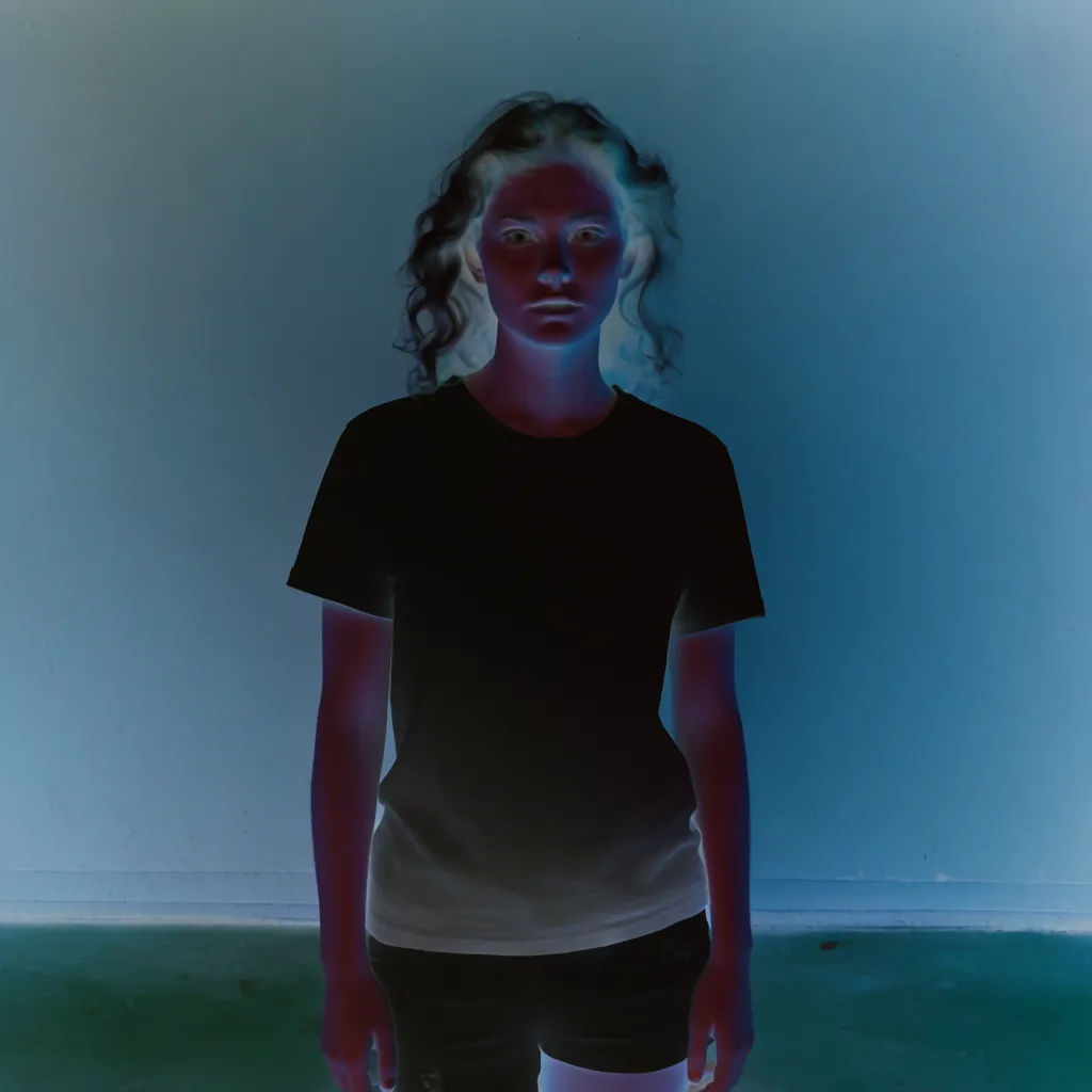 Portrait rendered as a film negative with reversed tones