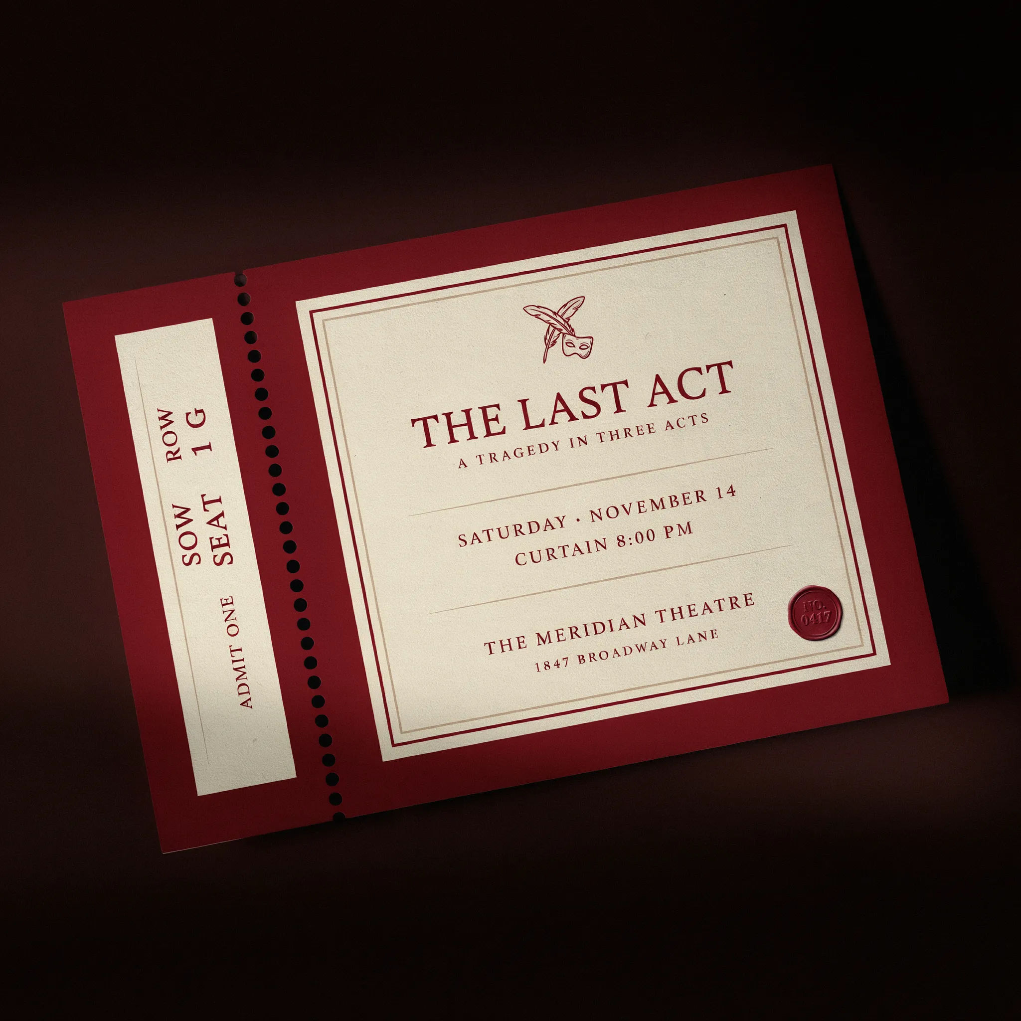 Theater event ticket in red and cream with seat row and number on the stub