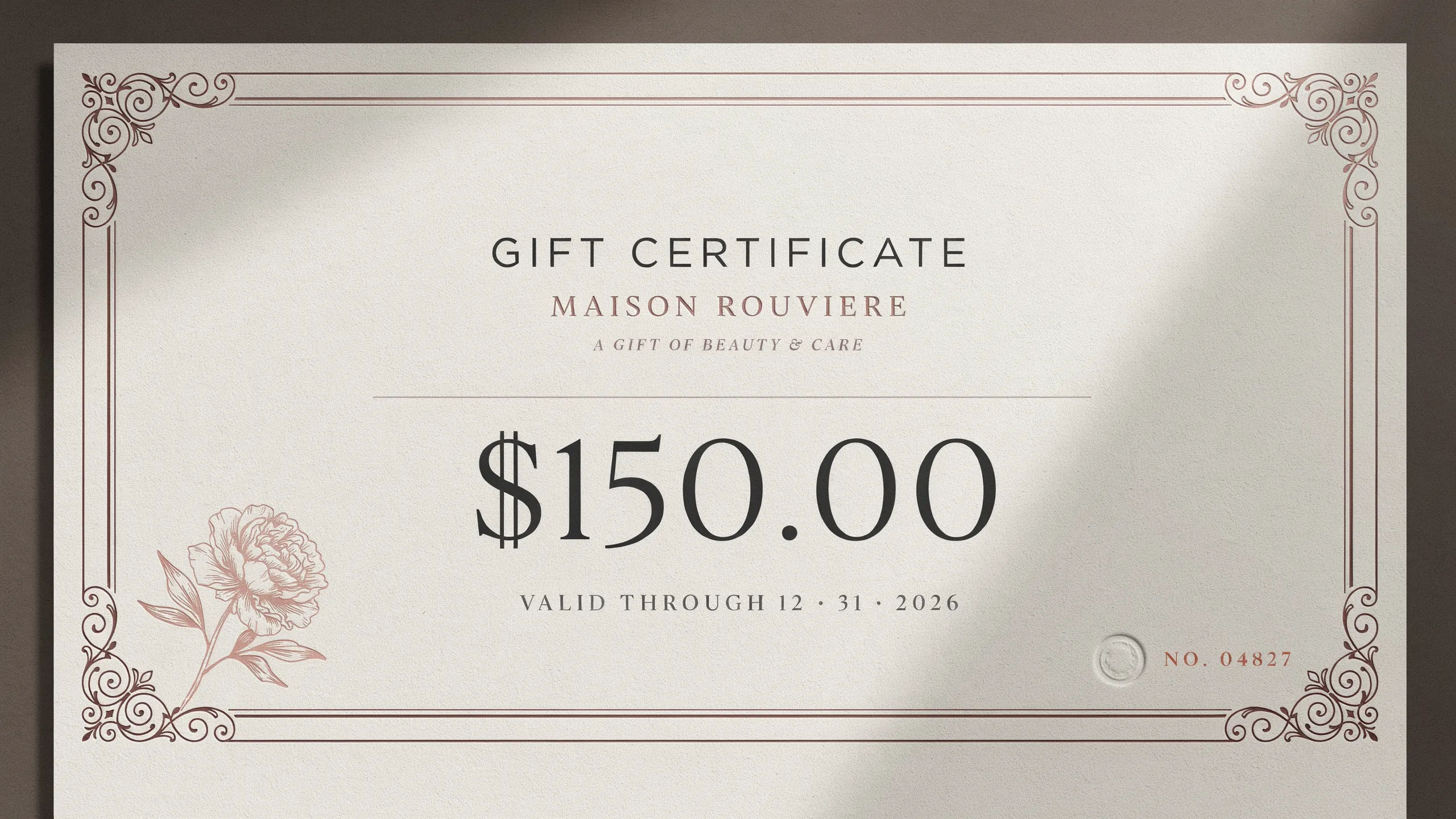Salon gift certificate in blush and rose gold with a floral accent