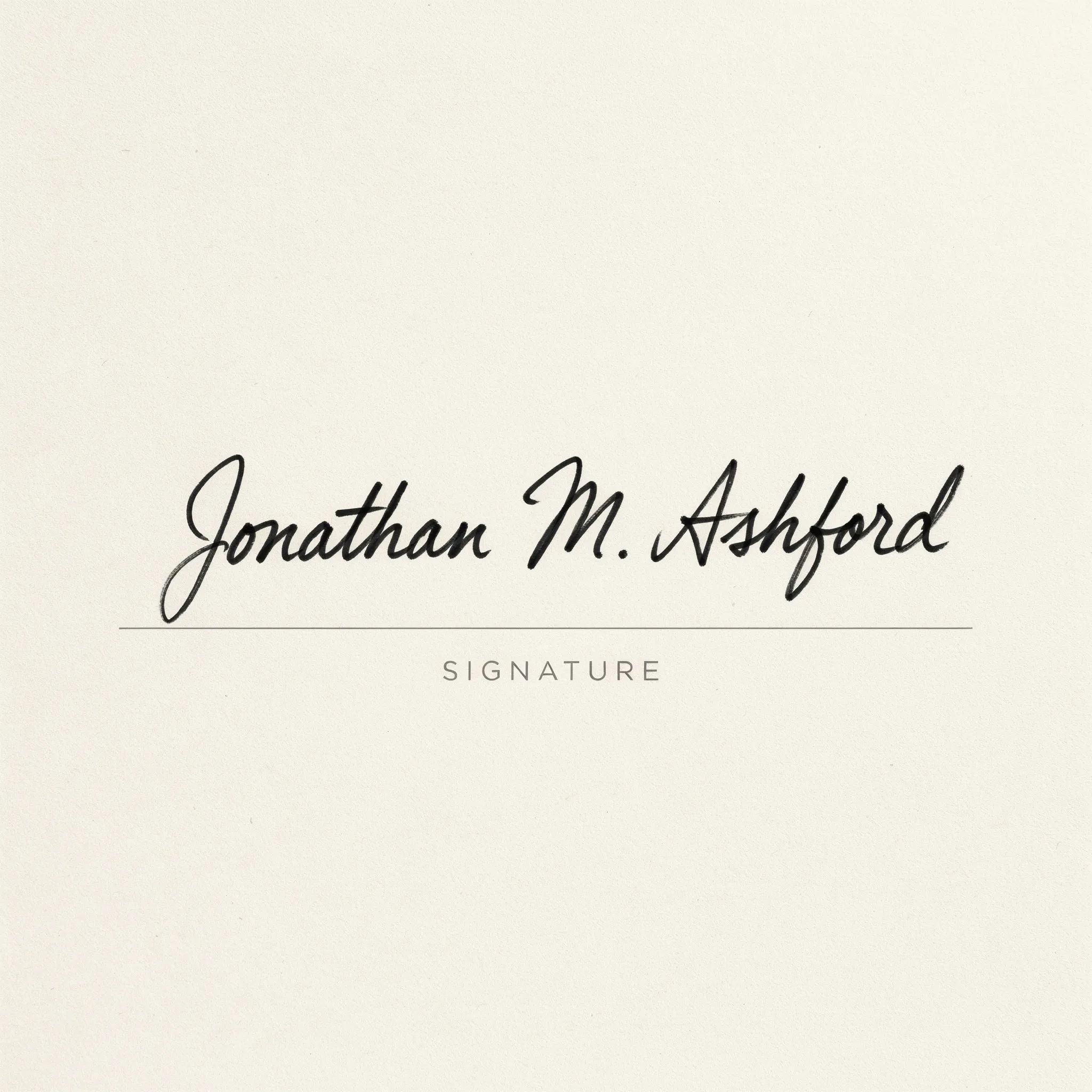 Bold black felt-tip signature with thick confident strokes