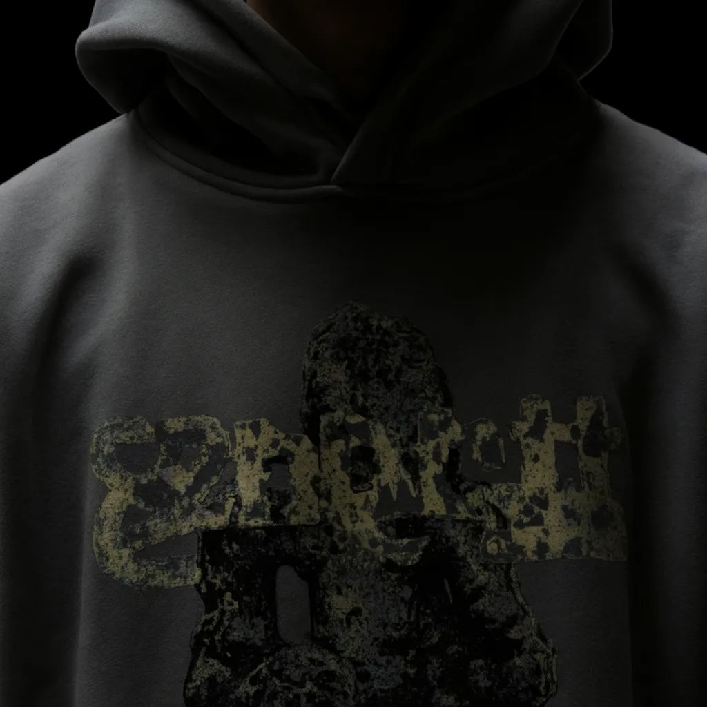 Close crop of a hoodie with the hood up showing a chest print