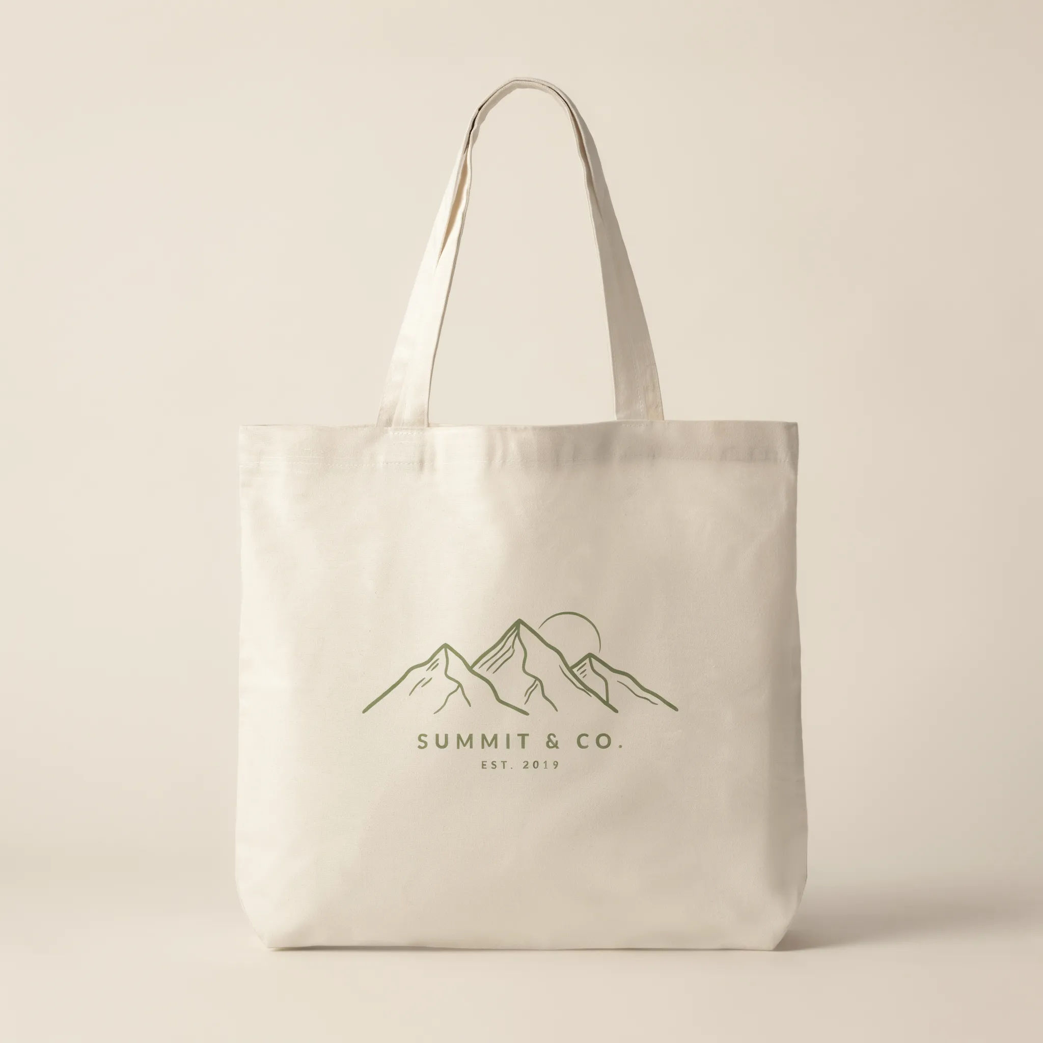 Canvas tote bag with a line-art mountain range graphic