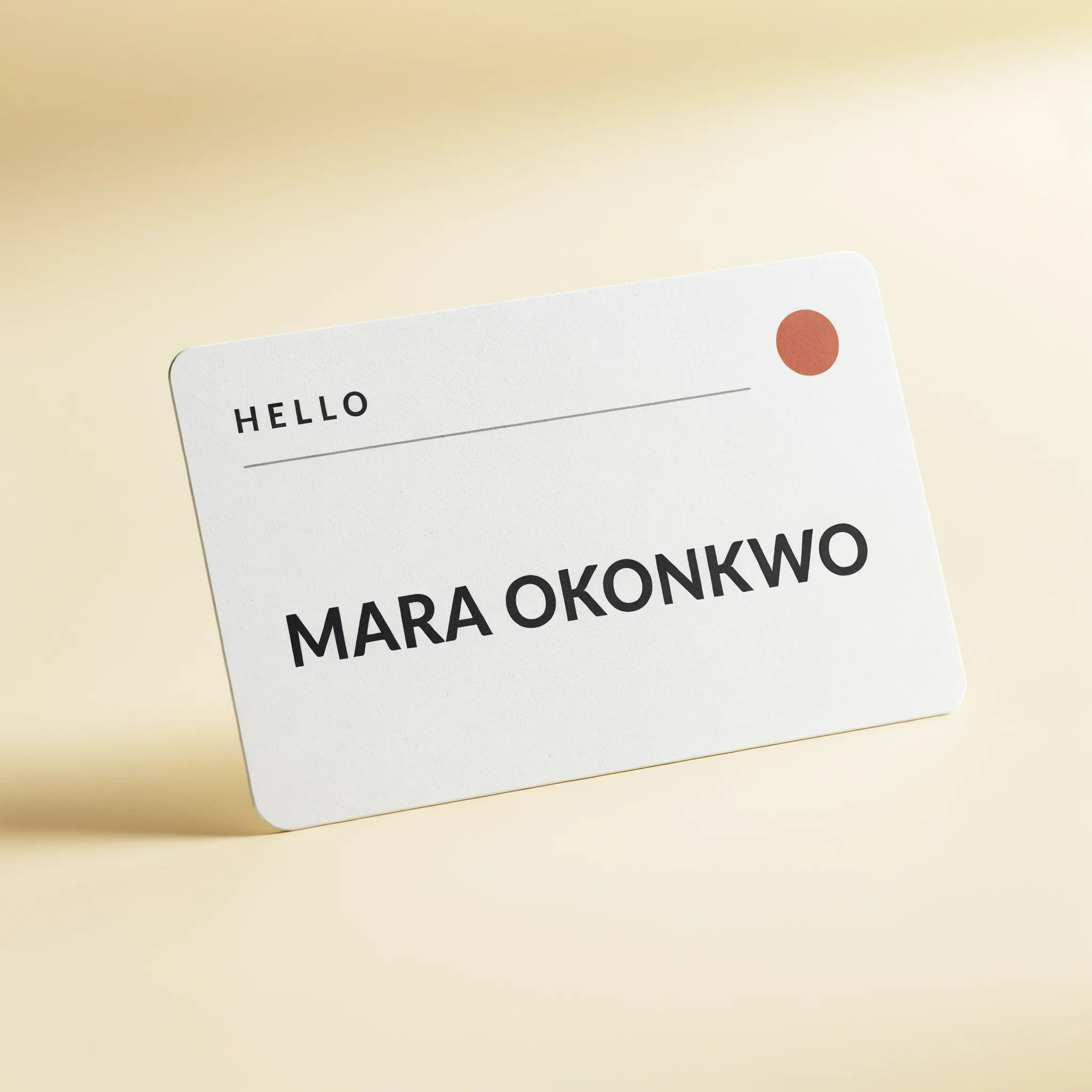 Minimalist white name badge with a thin line and open name field