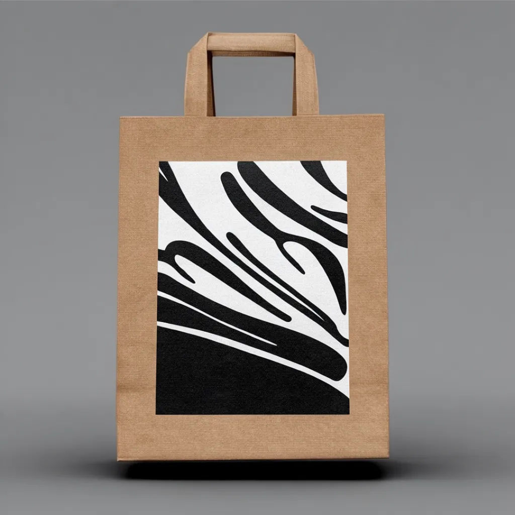Kraft paper bag with branding on a seamless grey studio backdrop
