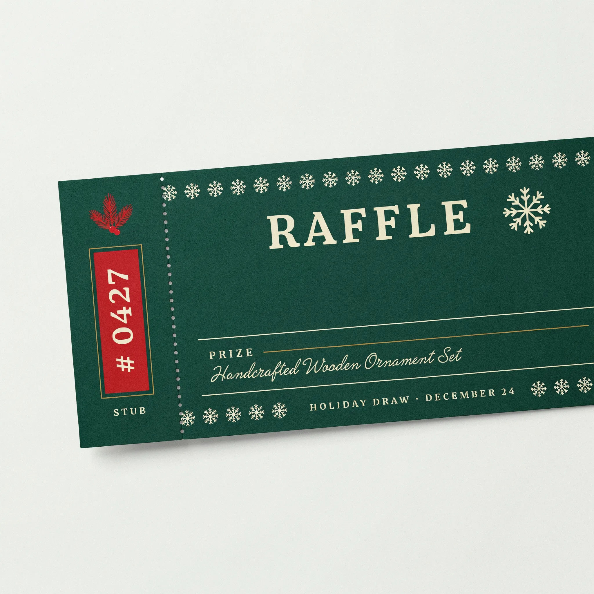 Holiday raffle ticket in green and red with pine accents and stub