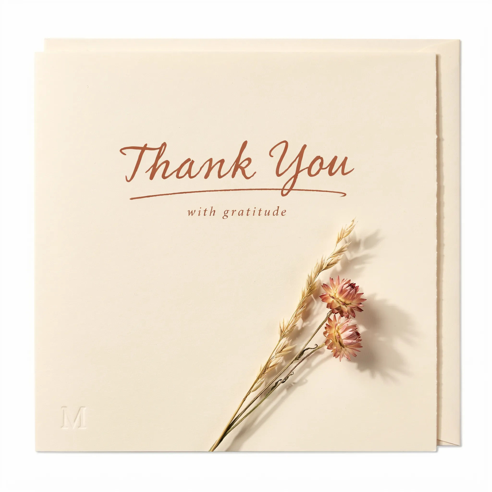 Warm neutral thank you card with dried floral sprig in terracotta and cream