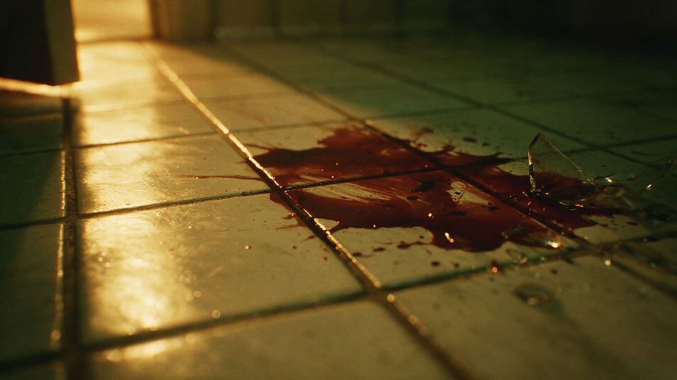 Pooled blood and broken glass
