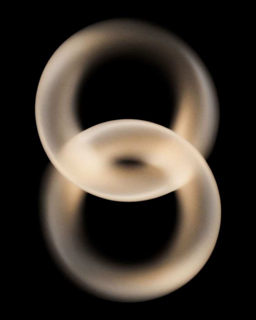 Two frosted glass arcs on a black ground