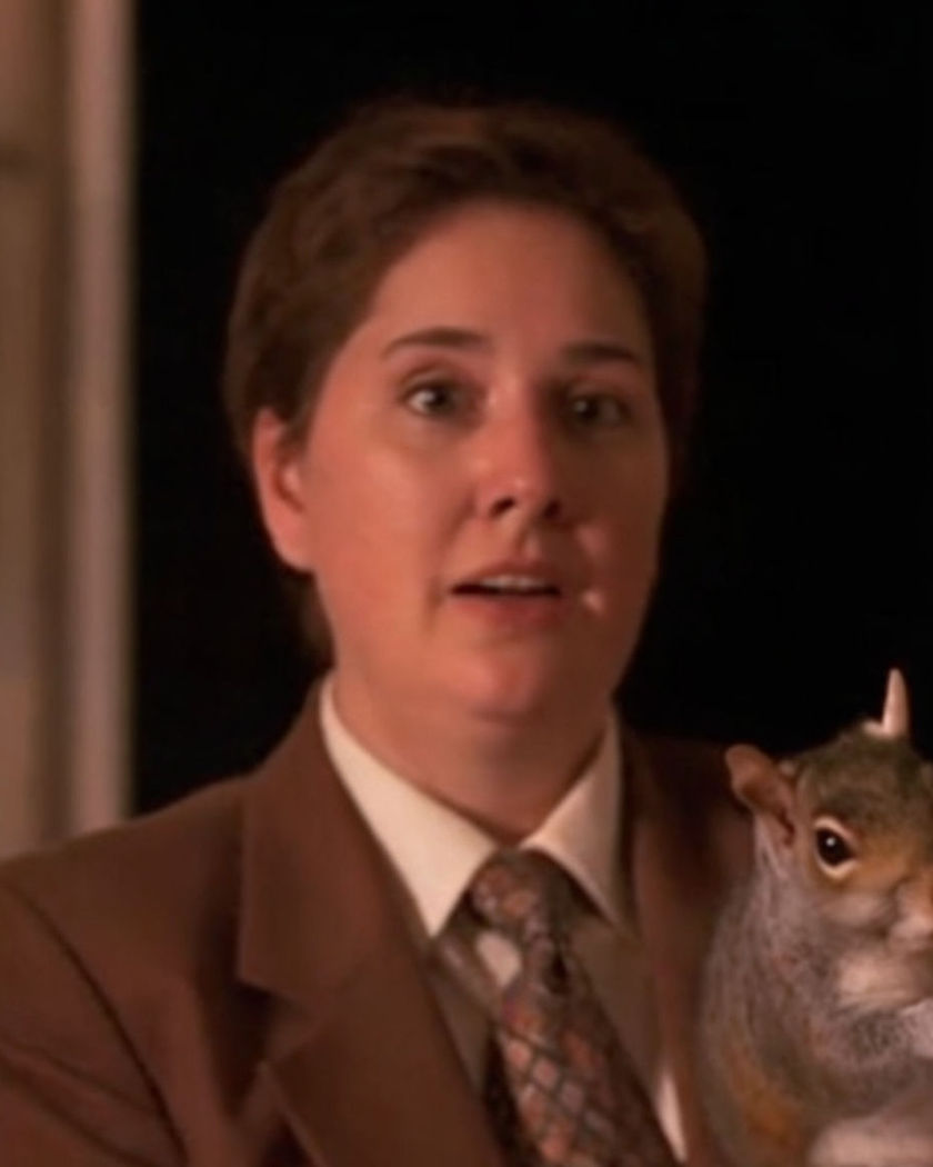 A surprised reaction as an animal suddenly appears beside a person in an ordinary indoor scene