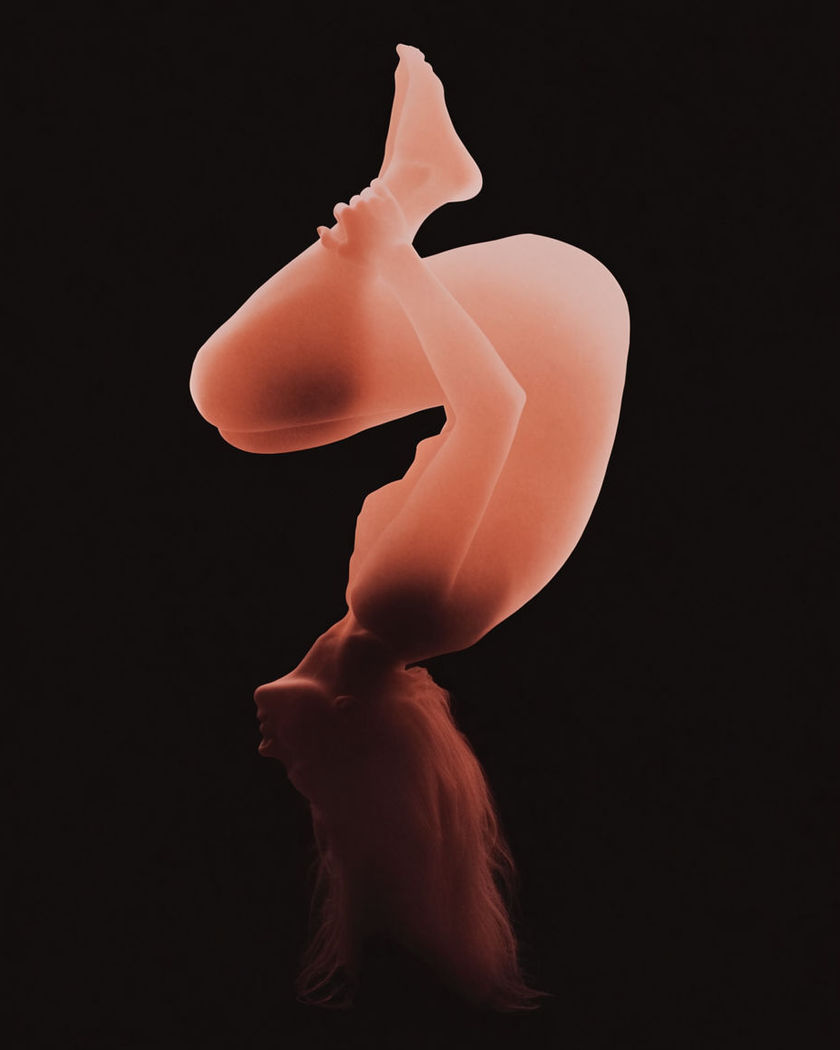A single figure frozen upside down mid-backflip, body arced and knees tucked against a black ground