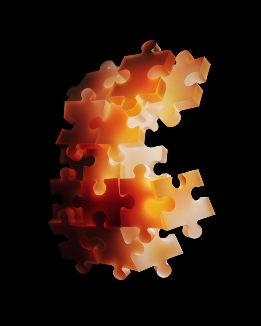 Interlocking jigsaw pieces assembling a warm festive image mid-air, a gap where the last piece lands, on a black ground