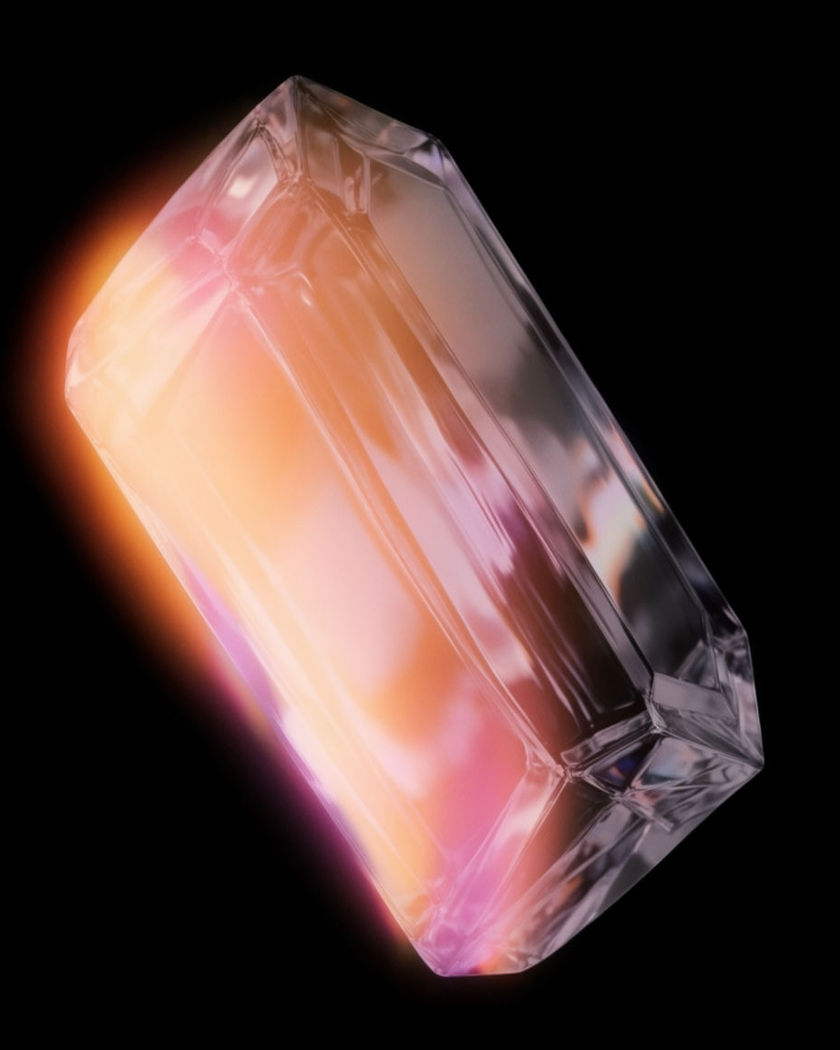 A crisp translucent crystal form lit cleanly from one side on a black ground