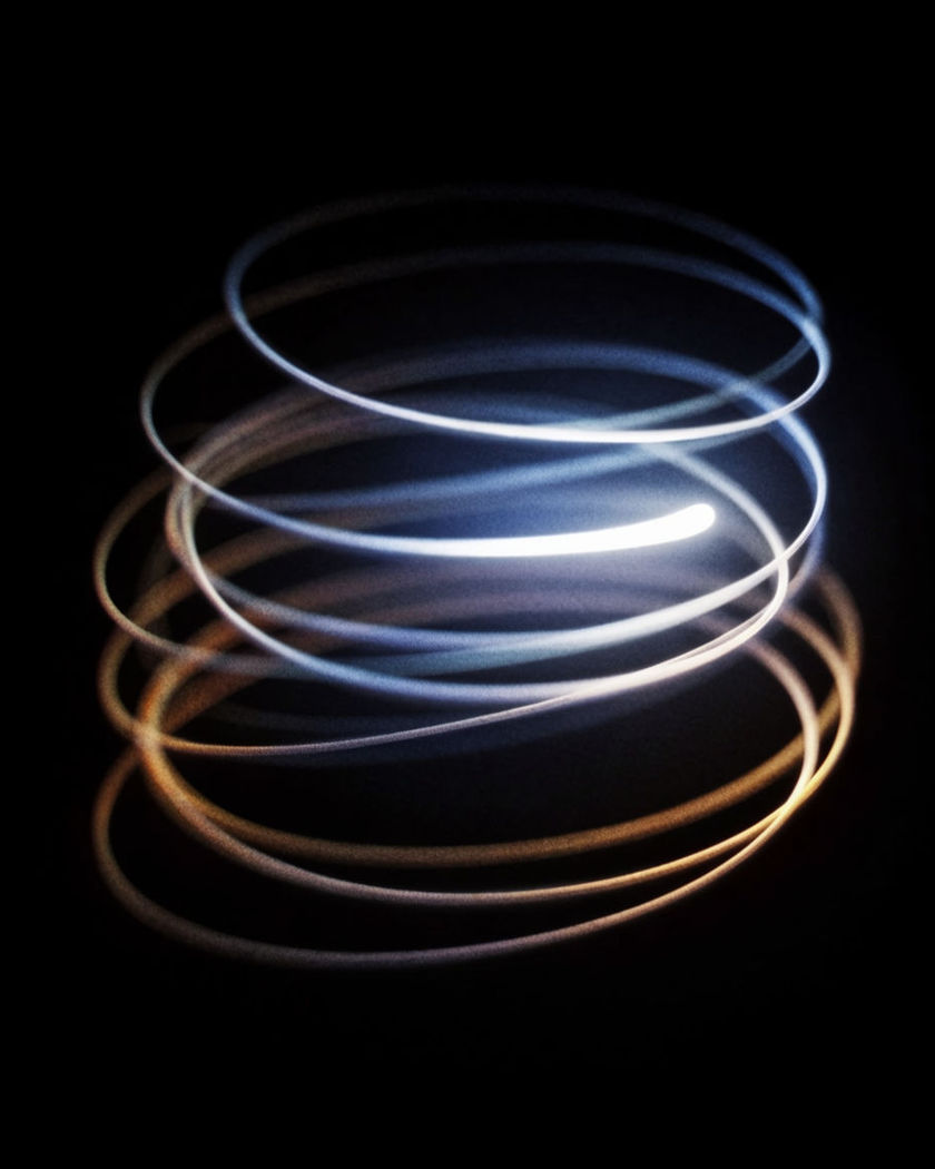A single luminous thread drawn into a loose stack of loops and spirals as if by a hand in on a black ground