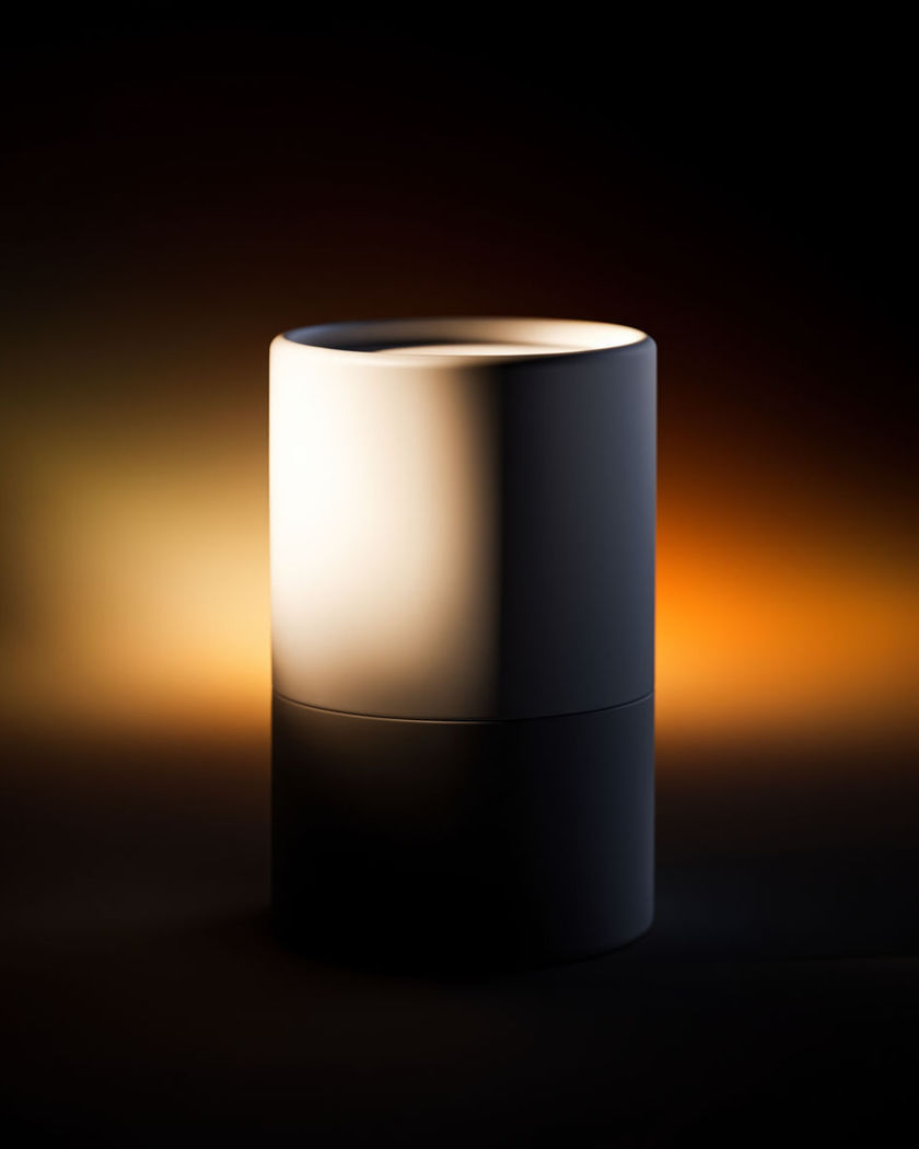 An unbranded product emerging from darkness as a single dramatic beam of light builds around it